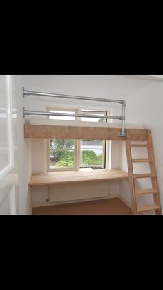 there is a loft bed with a ladder in the room