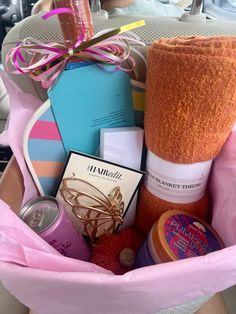 a pink basket filled with lots of different items