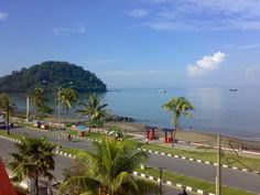 a view of the ocean from an apartment balcony