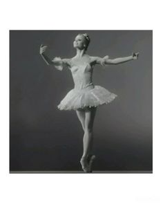 a black and white photo of a ballerina