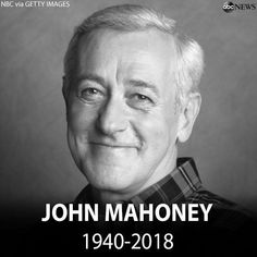 a black and white photo of john mahoney, who is smiling for the camera