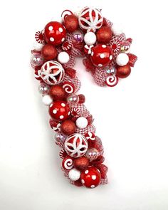 the number seven is decorated with red and white ornaments