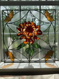 a stained glass window with flowers on it