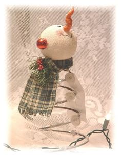 a snowman with a hat and scarf on it's head