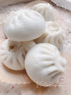 three dumplings sitting on top of a piece of paper