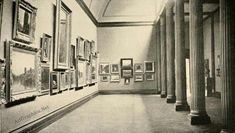 an old black and white photo of art on the wall