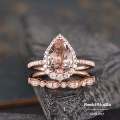 an engagement ring set with a pear shaped morganite