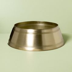 a metal bowl sitting on top of a table