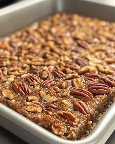 there is a square dish with pecans on it