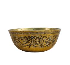 a gold colored bowl with designs on it