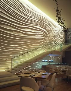 an empty restaurant with white chairs and tables