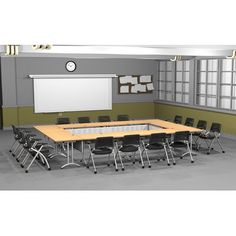 an empty classroom with desks and chairs in front of a whiteboard on the wall