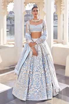 Falguni Shane Peacock Collection: MON AMOUR JAG NIWAS Powder blue chrome appliqué georgette Lehenga with baroque motifs and silver metal threads and yarns, teamed with a blouse with grid patterns and a tulle dupatta. Feather shrug is additional costs *This piece includes 3 - 4 inches of additional margin in the bodice/blouse to allow alterations up to 1.5 - 2 dress sizes. Falguni Shane Peacock, Indian Fits, Latest Bridal Lehenga, Indian Outfits Lehenga, Wedding Lehenga Designs, Desi Fits, Traditional Indian Dress, Desi Outfits, Indian Bridal Dress