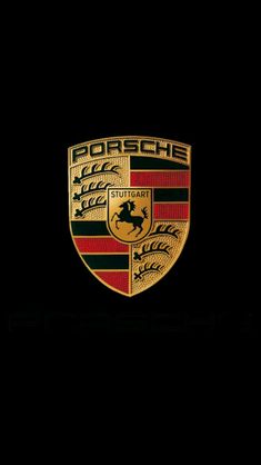 the porsche logo is shown in black and red, with gold trims on it