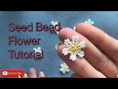 a person is holding some tiny flowers in their hand with the words seed bead flower tutor