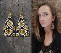 a woman standing next to a pair of beaded earrings