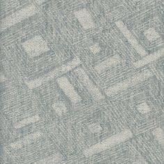 an upholstered textured fabric with squares and rectangles in light blue