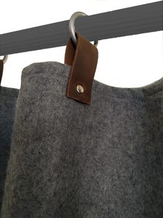 a close up of a bag hanging on a rail