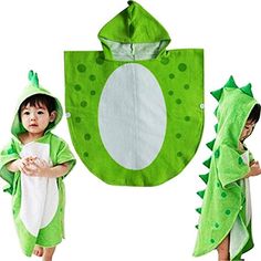 a little boy wearing a green dinosaur costume