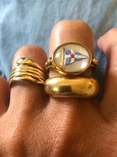 Antique 18K Essex crystal cabochon ring with reverse painted nautical flag and bead design.  I believe the flag represents the Royal Thames Yacht Club (founded 1775).  It is in very good antique condition.  Since this is a hand painted piece with a closed back, the ring should not be immersed in water.   Approximate ring size: 7-1/4 Ring weighs approximately 5.3 grams. Stamped '18' on back of face, but the bottom half is worn off.  There is also an '18ct' stamp on the shank. Please see all photo Nautical Flag, Nautical Flags, Reverse Painted, Sail Boat, Cabochon Ring, Rolex Oyster, Ring Pictures, Yacht Club, The Flag