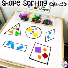 the shape sorting table is filled with different shapes