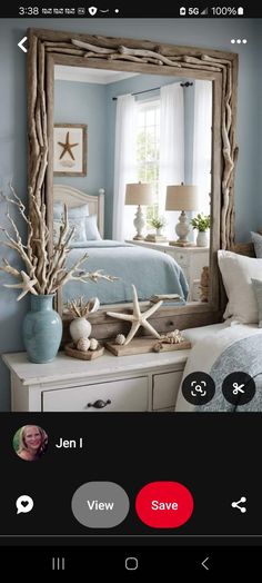 an image of a bedroom with blue walls and white furniture in the reflection of a mirror