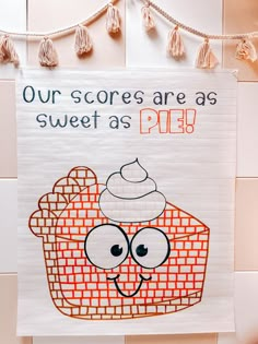 a sign that says our score is as sweet as pie on the side of a wall