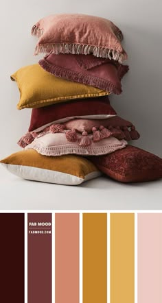 the color palette is brown, yellow and pink with different pillows on top of each other