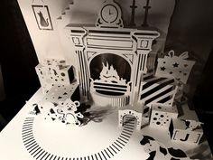 an image of a fireplace with paper cut out