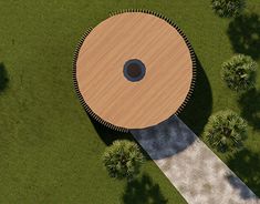 an aerial view of a wooden structure in the grass