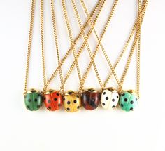 "These are the most adorable necklaces ever! These little Vintage ladybugs come in multiple colors and are just precious! 1960s. GET THEM WHILE THEY LAST!! Available on gold tone finding or silver tone finding. We are sorry, but we are all sold out of red ladybugs! We are searching for more! Price is for one ladybug necklace. Convo me if you would like more than one. Material: Resin. They are about 3/4\" in length and about 5/8\" across and hang from a 16\" vintage chain. In very good condition. Ladybug Vintage, Diy Merch, Ladybug Necklace, Ladybug Jewelry, Bug Jewelry, Vintage Hair Clips, Ceramic Necklace, Vintage Chain, Insect Jewelry