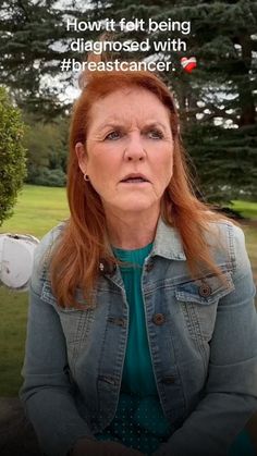 a woman with red hair is looking at the camera and has an angry look on her face