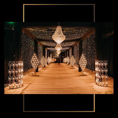 an image of a walkway decorated with christmas lights and decorations for a wedding or special event