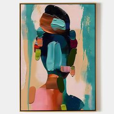 an abstract painting with blue, pink and green colors on it's face is featured in a gold frame