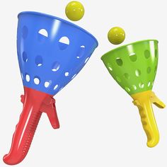 two plastic toy funnels with balls coming out of them