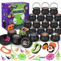 halloween party favors and decorations are arranged in front of a box