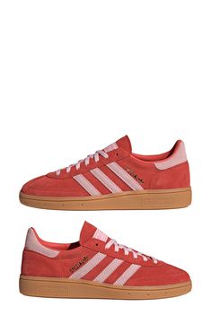 A low profile maintains the range-of-motion comfort of a handball shoe reborn as a sneaker that pairs an upper of soft corduroy with a classic gum-rubber sole. Lace-up style Removable insole Leather and textile upper/textile lining/rubber sole Imported Red Sambas, 2025 Wardrobe, Adidas Handball Spezial, Adidas Handball, Adidas Spezial, Red Sneakers, Shoe Inspo, March 25, Red Adidas