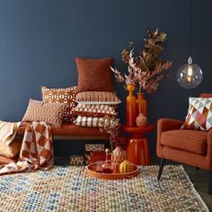 a living room filled with furniture and pillows