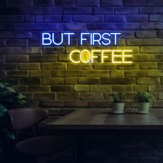 there is a neon sign that says but first coffee on the side of a brick wall