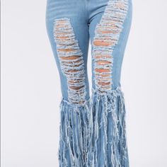 Features: I'll Crazy Distressed Light Denim Pants With Fringes On The Sides Giving You That Nice Curvy Fit Fabric & Care: 100% Polyester Wash In Cold Water Tumble Dry Or Hang Dry Trendy Denim Blue Bottoms With Fringe, Spring Fringe Medium Wash Jeans, Spring Fringe Jeans In Medium Wash, Spring Medium Wash Jeans With Fringe, Spring Wide Leg Bottoms With Fringe, Trendy Denim Bottoms With Fringe, High Rise Denim Blue Fringe Bottoms, High Rise Denim Blue Bottoms With Fringe, Trendy High Waist Fringe Jeans