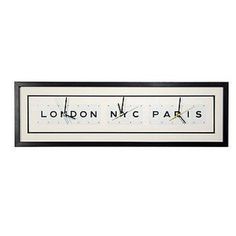 a black and white framed sign with the words london n c paris on it's side