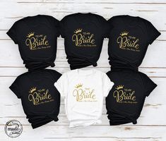 Personalised Bachelorette Party Shirts, Bride Gift Team Bride Shirt, Wedding Party Shirt, Personalized Bride, Party Shirts, Bride's Team Tee For gold font, please specify in the personalization section. NOTE: We use black design for White, Light Grey Heather( Athletic Heather), Pink, Heather Peach, Mint Green, Burnt Orange colors. For other colors we will use white design. Hello! First of all thank you for being here and checking out our finest t-shirt designs. As Mudo Boutique, we dedicated ourselves to provide the best possible service for our valuable customers. In order to provide you best service, we are using the quality materials and beautiful designs. You can always contact us for your questions or for your suggestions. We are open for your suggestions. - Please check the size char Gold Long Sleeve Top For Wedding, Black Short Sleeve Shirt For Wedding, Long Sleeve Tops For Wedding And Party Season, Long Sleeve Tops For Wedding Party Season, Gold Long Sleeve Wedding Top, Bride Team Shirt, Bride Squad Shirts Funny, Team Bride Shirts Glitter, Customizable Short Sleeve T-shirt For Bachelorette Party