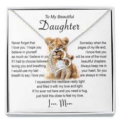 a necklace with an image of a dog holding a heart and the words to my beautiful daughter