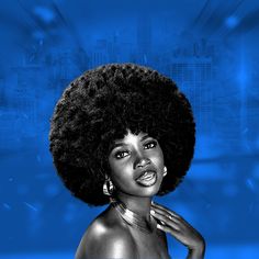 a woman with an afro standing in front of a blue background