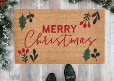 Deck your doorstep with this festive Merry Christmas Coir Doormat! Handmade and ready to bring festive cheer to any porch, this holiday doormat features script Merry Christmas text in red and holiday greenery and comes in three sizes perfect for any entryway Diy Rug Painting, Holiday Doormat, Door Mat Diy, Merry Christmas Text, Fall Doormat, Halloween Door Mat, Holiday Greenery, Christmas Text, Christmas Doormat