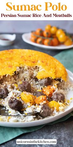 a close up of a plate of food with rice and meats on it next to oranges