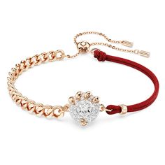 Crafted for the Year of the Dragon, this inspired bracelet is a perfect example of Swarovski savoir-faire. The rose gold-tone plated design features a central dragon’s claw, which holds on tightly to a lucky coin adorned with a pavé of clear crystals. Around the wrist, the bracelet features a linked chain on one side, and red fabric on the other. Bright and energizing, this jewelry would make a perfect gift for a loved one. Luxury Red Metal Bracelets, Luxury Red Metal Bracelet, Phoenix Bracelet, Red Watch, Pink Watch, Blue Watches, Rose Gold Watches, Year Of The Dragon, Clear Crystals