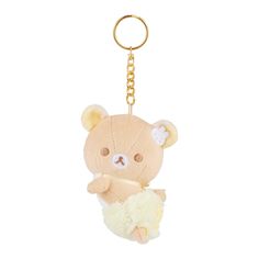 a teddy bear keychain hanging from a gold chain on a white background,