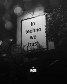 a black and white photo of a sign that says in techno we trust