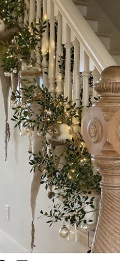 the stairs are decorated with greenery and candles